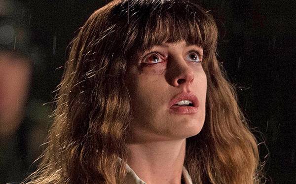 Colossal Photos Have Anne Hathaway & Jason Sudeikis Vs a Monster