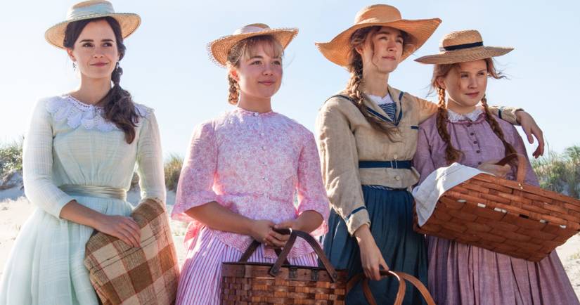 Cast of Little Women with picnic baskets in the sun