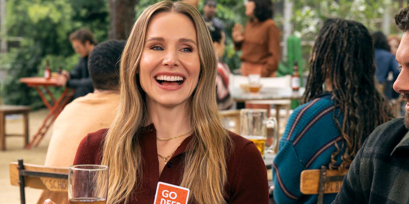 Kristen Bell's Joanne smiling while playing a card game in Nobody Wants This season 2
